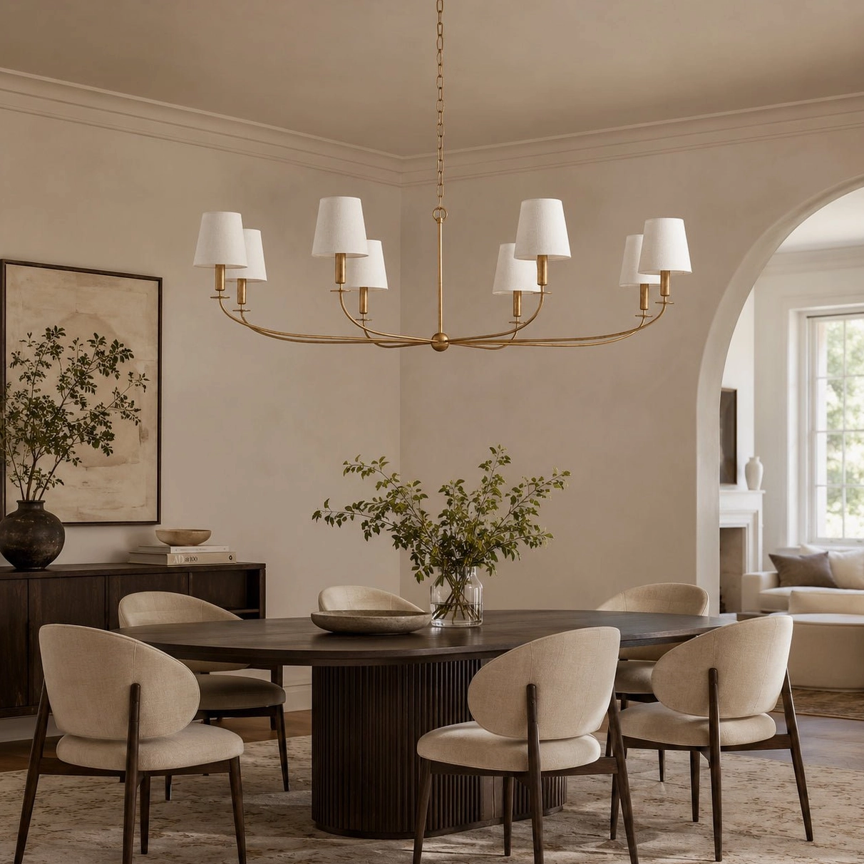 Emaani Candle Chandelier with fabric-shaded candleholders in formal dining space, white tapered shades brass frame