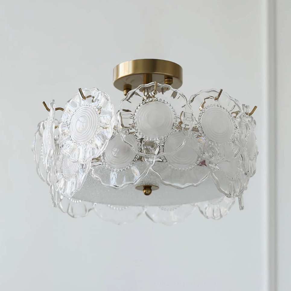 Clear textured glass ceiling lamp with embossed pattern and brass frame on minimalist white wall background