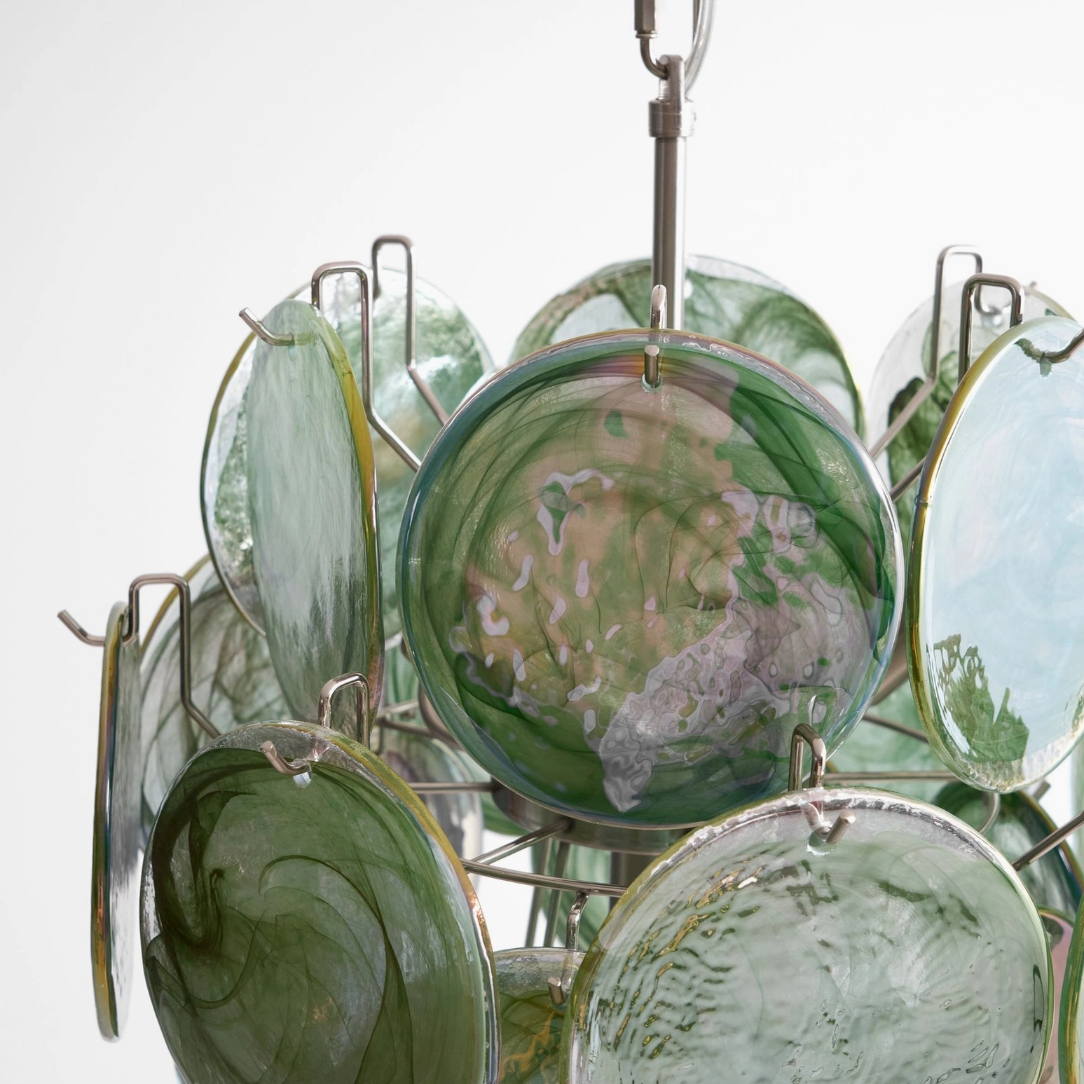 Emerald disc chandelier bottom view glass disc arrangement architectural lighting design