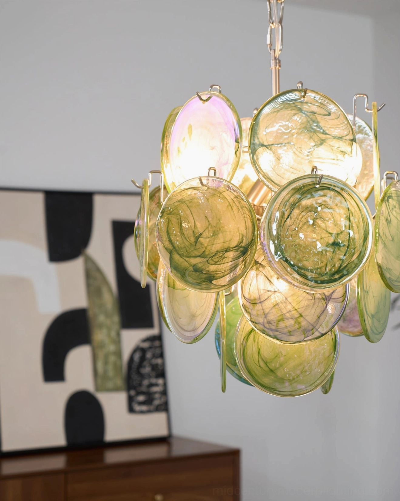 Emerald disc chandelier side profile view Murano glass disc components metal frame