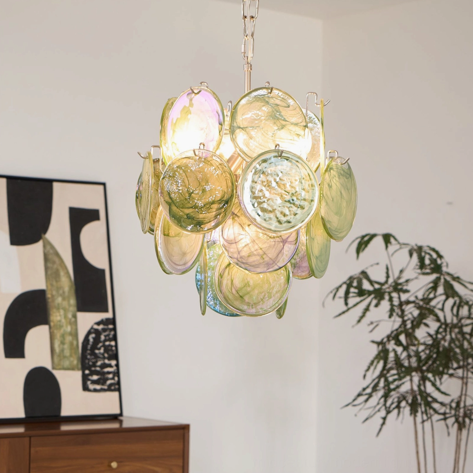 Yellow-green warm tone art glass disc chandelier side hanging view artistic lighting