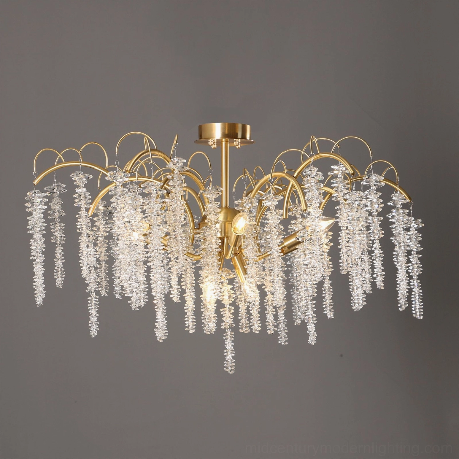 Emily Branch elegant luxury chandelier capturing prismatic light refraction through hand-cut crystal drops