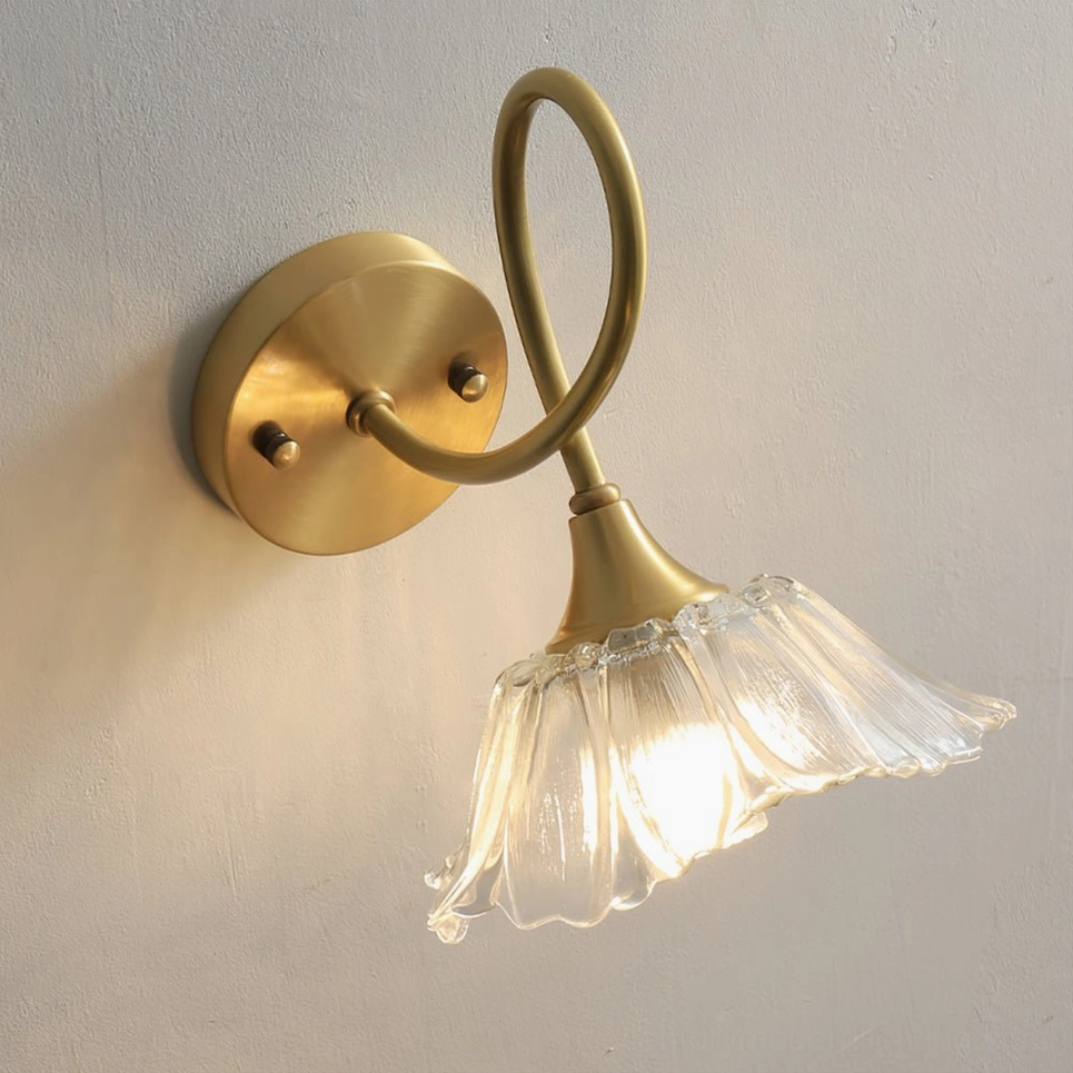 Ercole floral wall lamp showcasing botanical-inspired sculptural design and brass construction