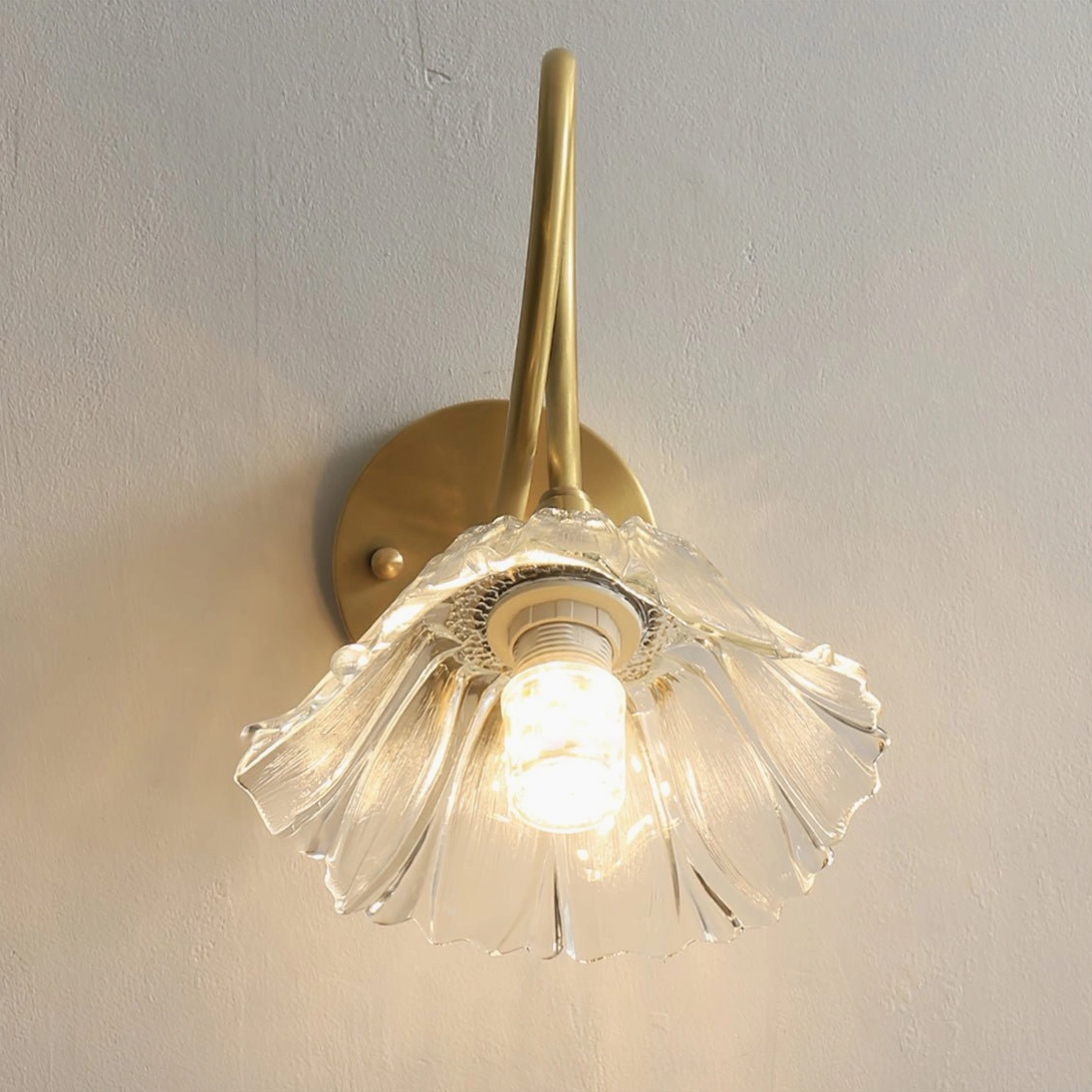 Ercole brass mid-century modern wall sconce with flower-shaped design and warm lighting effect