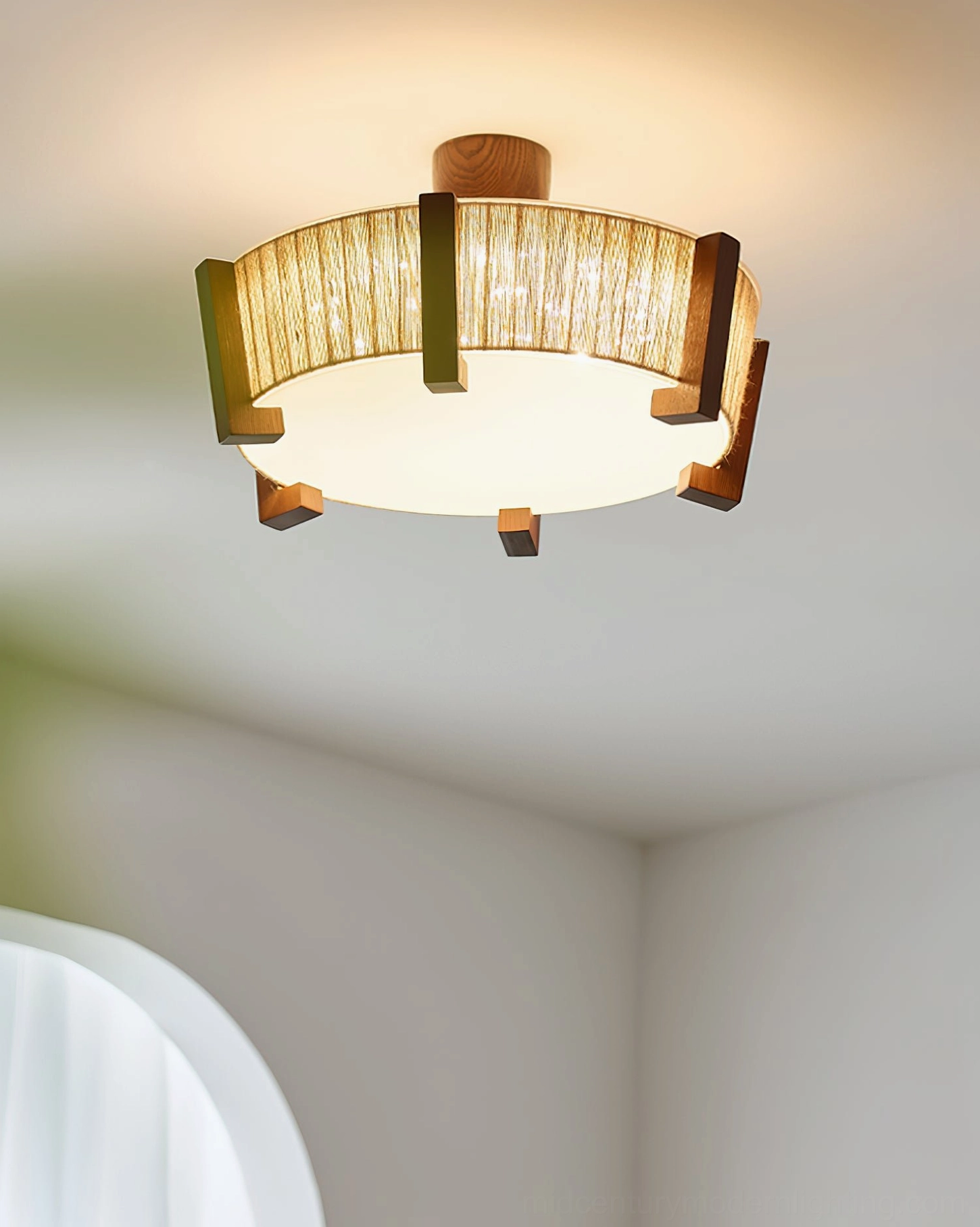 Euluna semi-flush ceiling light with frosted bottom diffuser viewed from low angle in simple white room