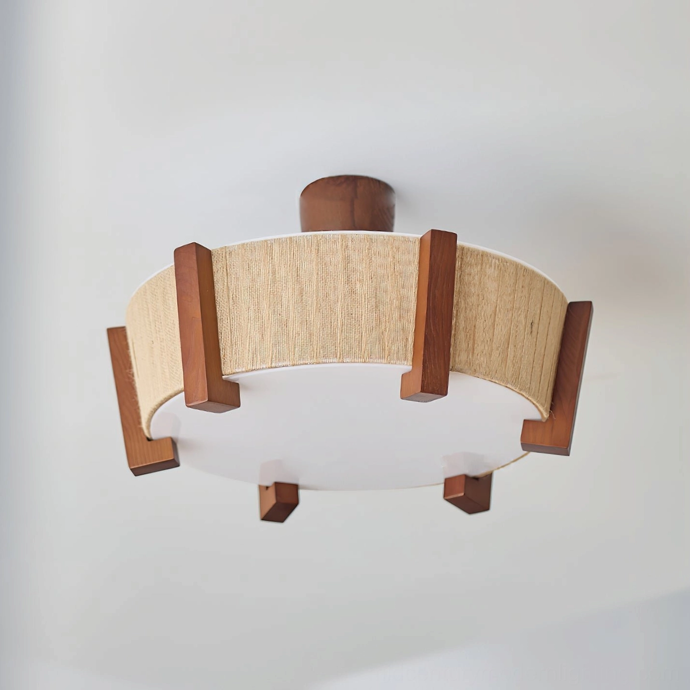 Euluna ceiling light detail shot highlighting walnut wood trim and beige linen fabric rustic design elements