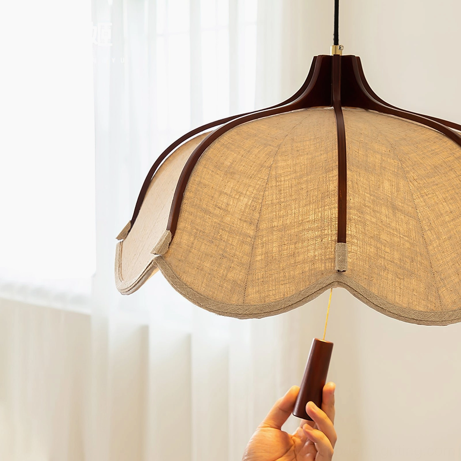 Evelyn mid-century modern pendant lamp showcasing walnut wood finish and beige fabric construction