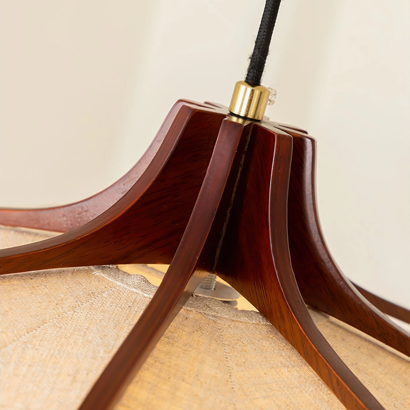 Evelyn pendant lamp hanging above dining surface, warm lighting ambiance in home interior