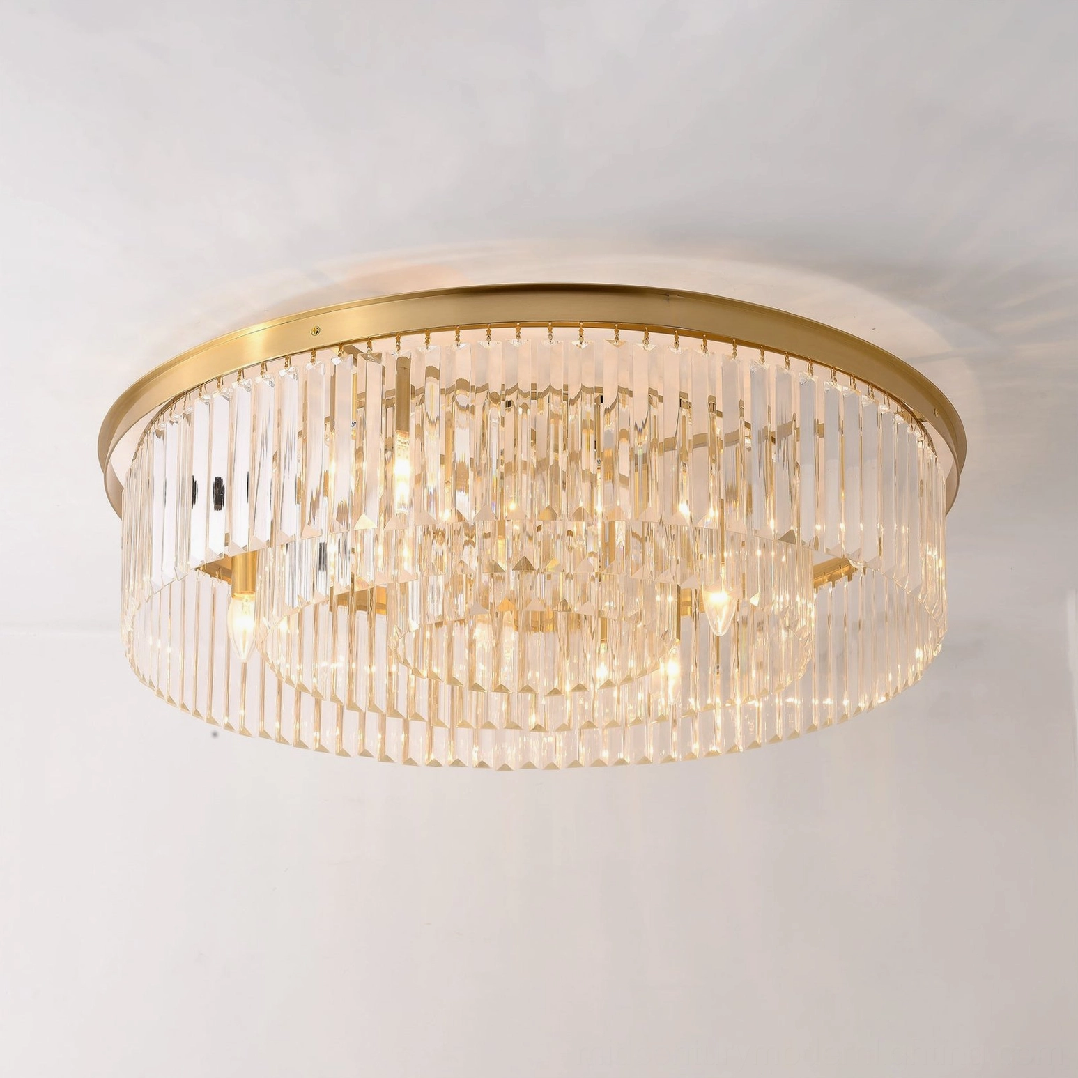 Close-up detail of Evina ceiling light bright faceted crystal accents and brass metalwork