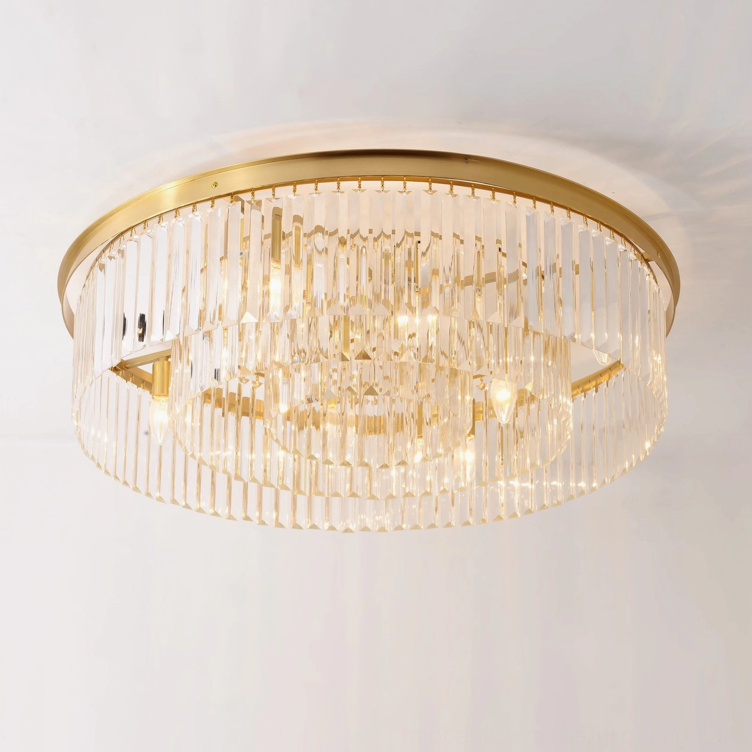 Evina flush mount ceiling chandelier with cascading crystal strands angled view warm glow
