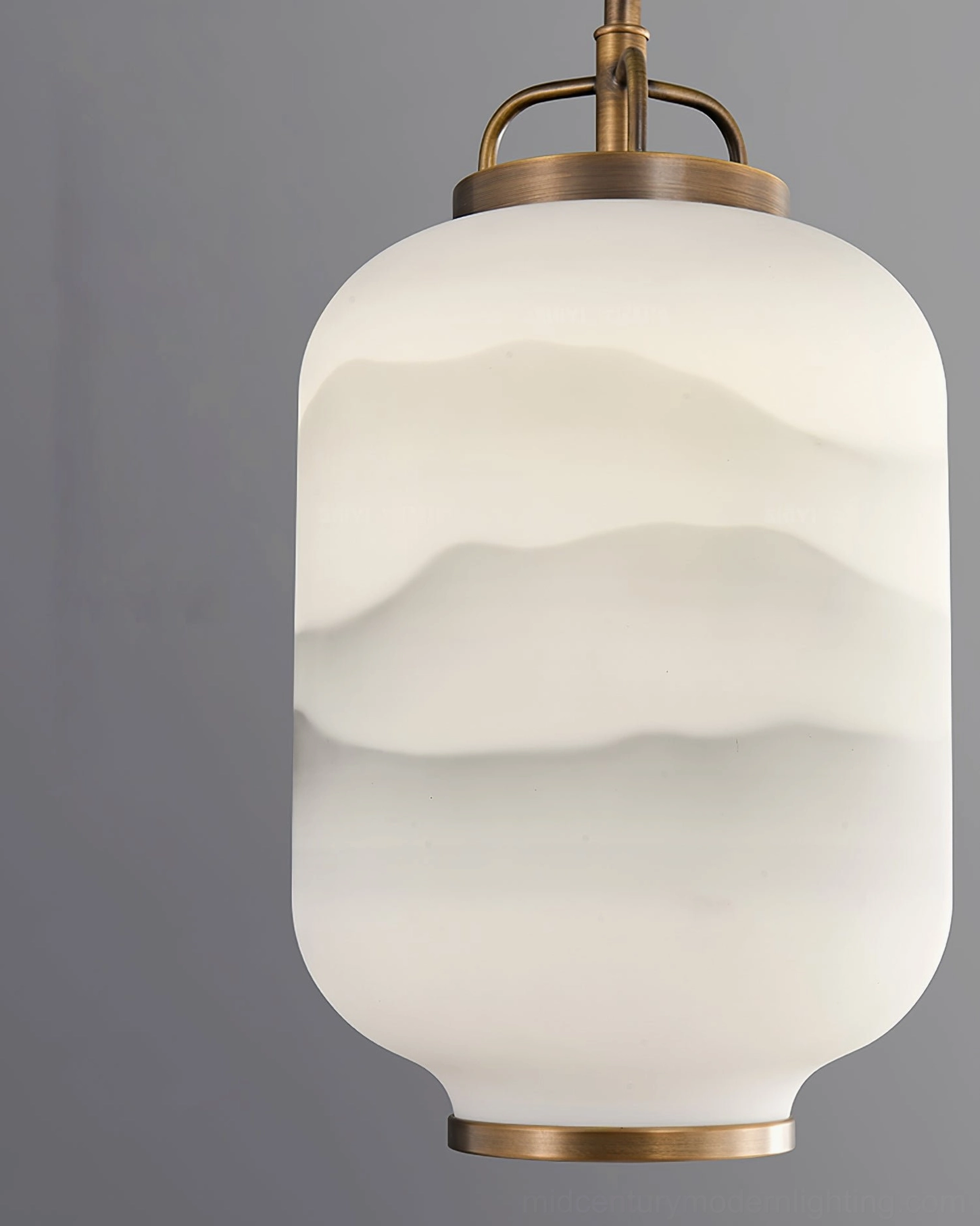 Close-up of Ezio frosted glass cylinder with etched mountain landscape pattern