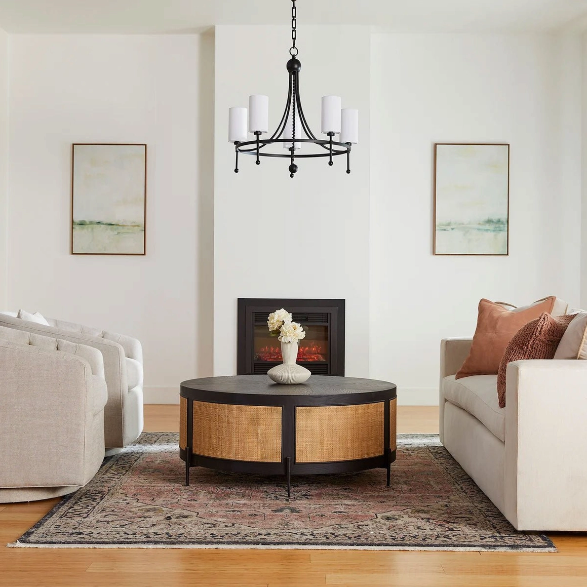 Fenwick black 5-light chandelier in cozy classic living room with area rug and traditional decor