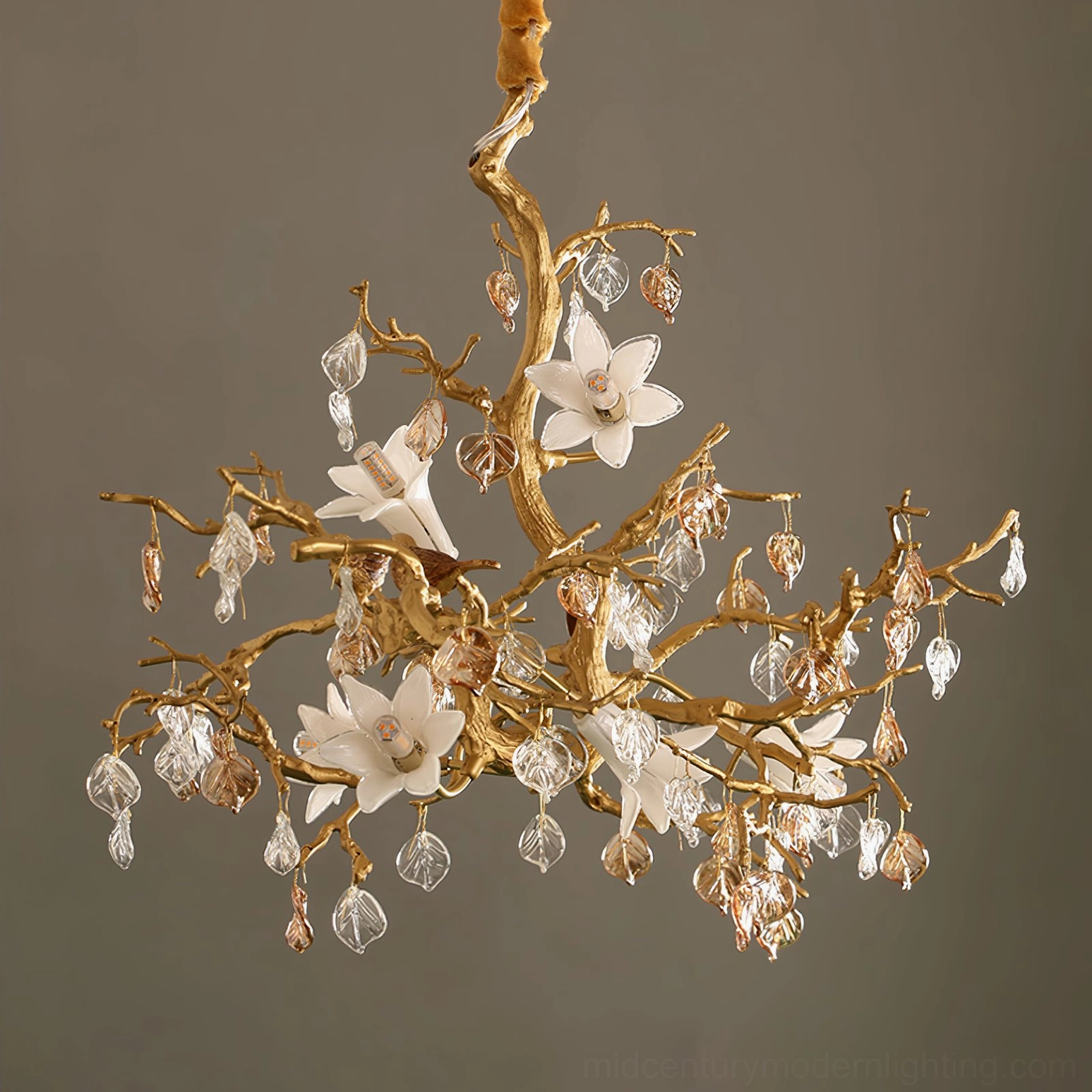 Fiori brass chandelier side profile showing organic branching structure with ceramic blossoms and glass crystals