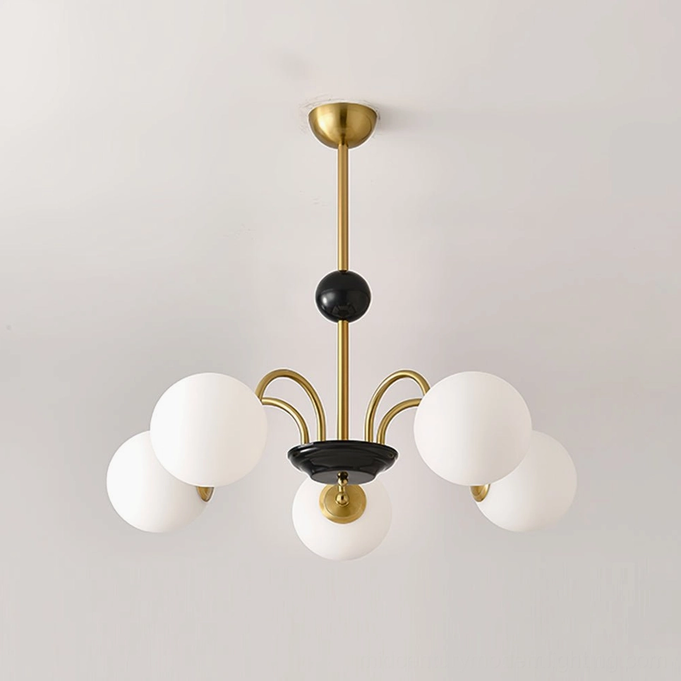 Five-head globe chandelier with gold-black metal frame and frosted glass in modern space