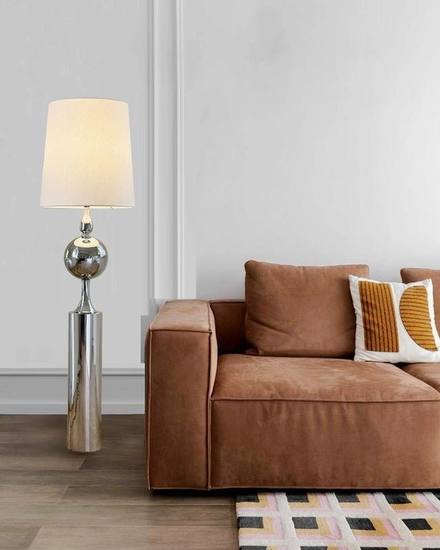 Articulated chrome floor lamp positioned at various angles demonstrating flexible arm positioning capabilities and lighting adaptability