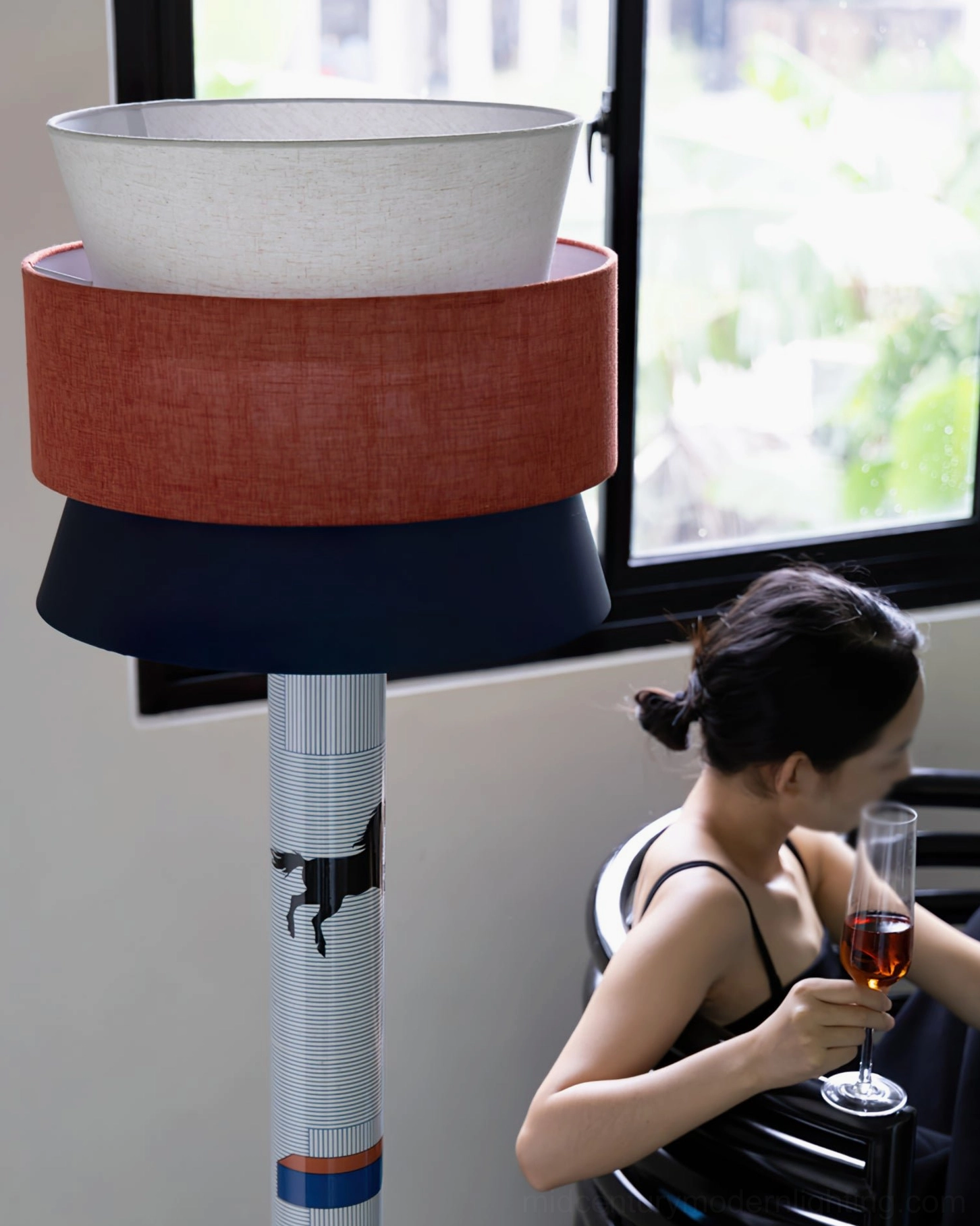 Close-up detail of marble floor lamp base and woven linen shade showing horse print and striped pattern design