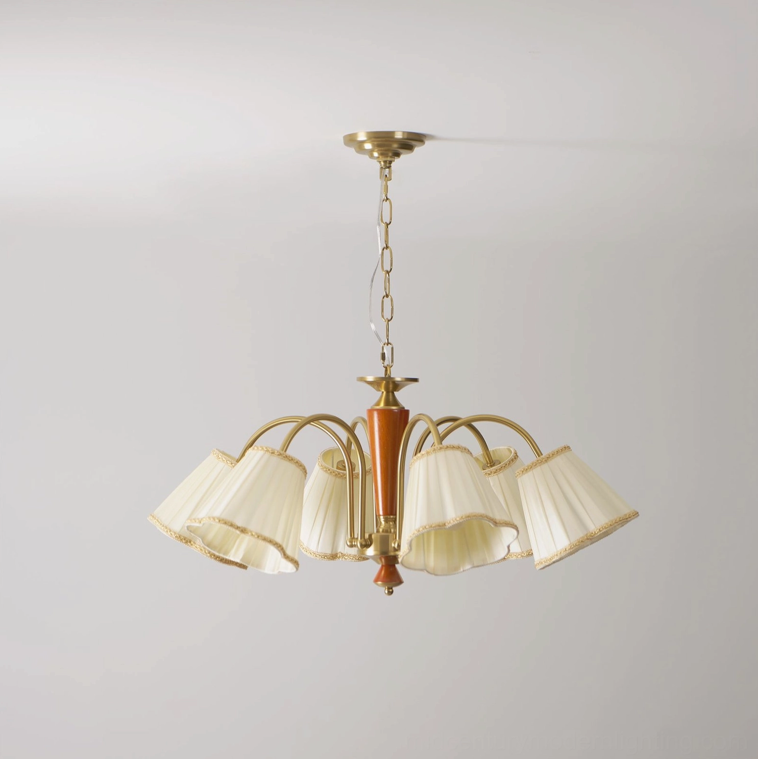 Florentine fabric chandelier 8-light configuration with pleated cream shades and brass frame on white background