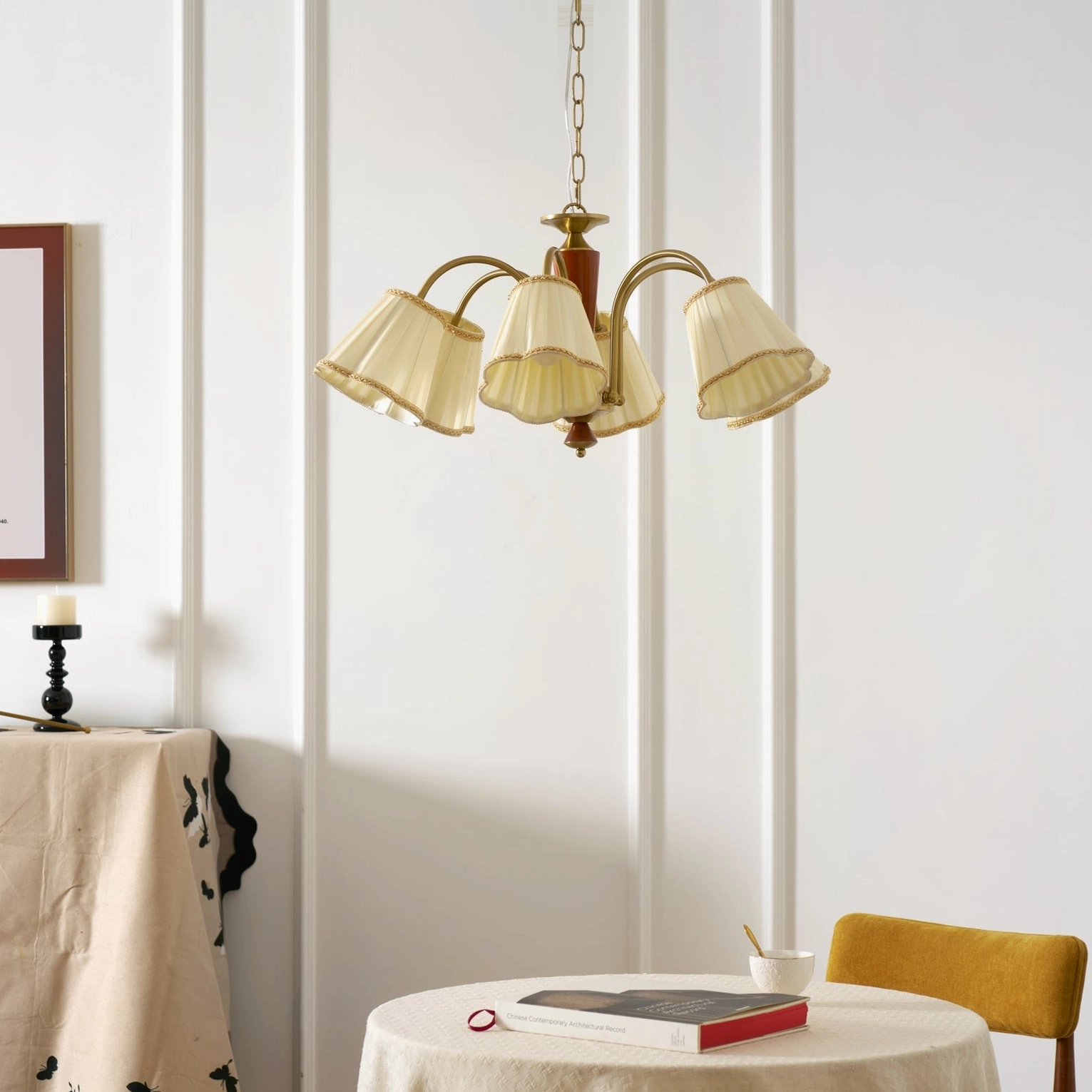 Florentine fabric chandelier upward angle showing brass metal arm structure and pleated fabric shades detail