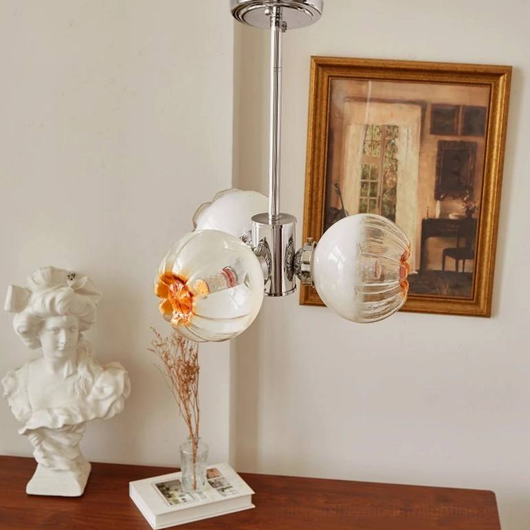 3-head Flower Bud Chandelier with gradient amber glass petals and polished chrome metal frame detail