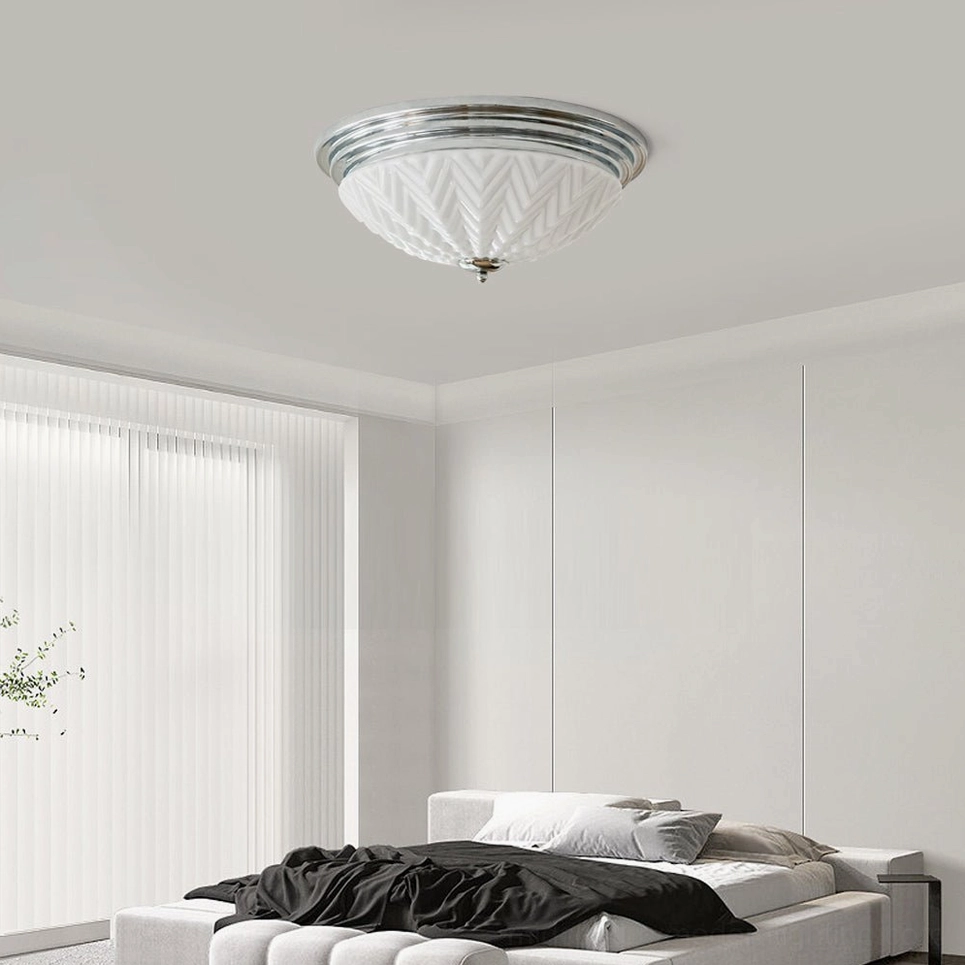Minimalist flush ceiling lamp in bright white bedroom, wide angle overhead view, clean contemporary interior design