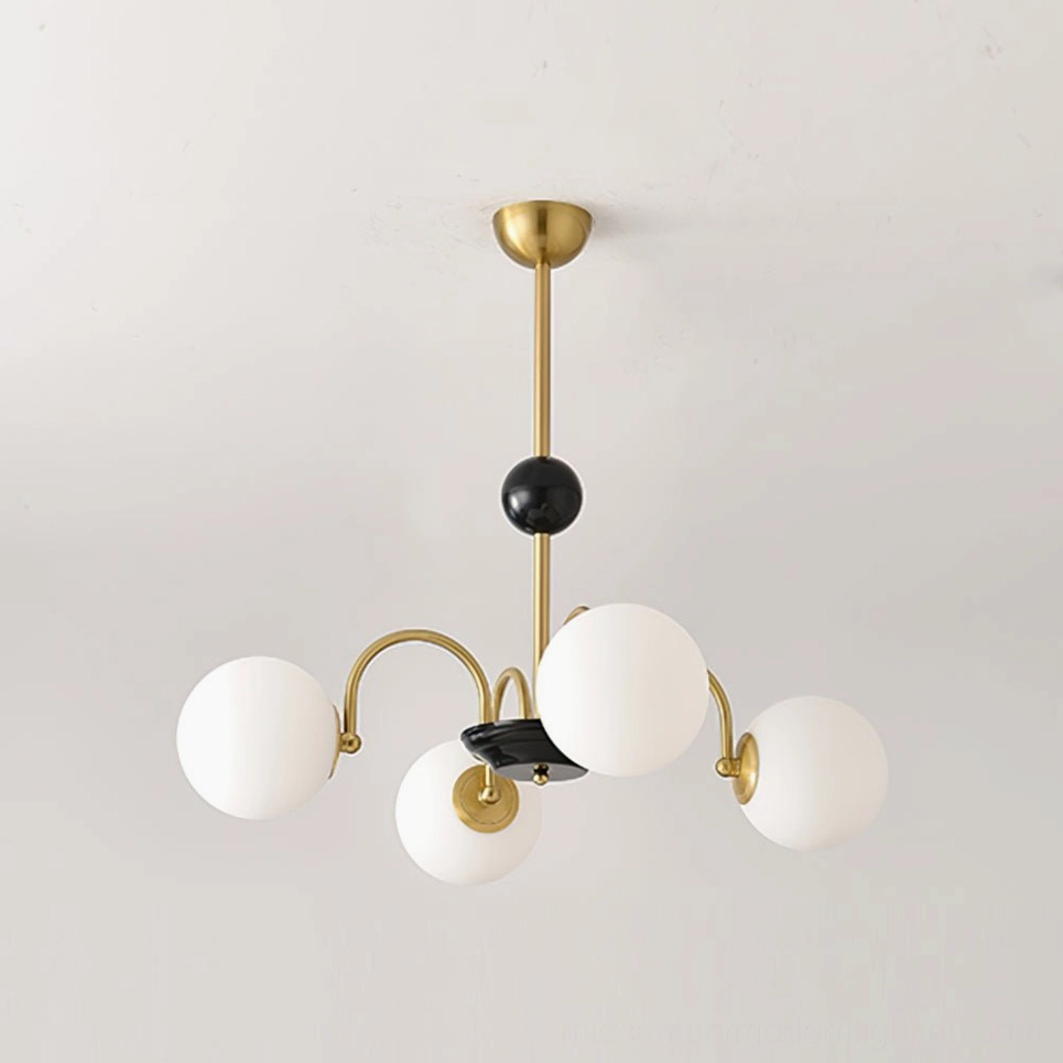 Four-head globe chandelier with gold-black metal frame and frosted white glass globes, product detail view