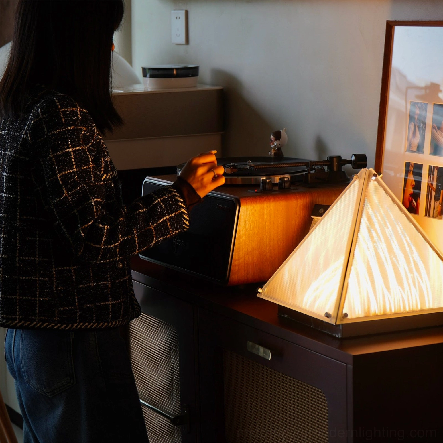Fragment chrome pyramid table lamp detailed side angle showing frame and shade construction