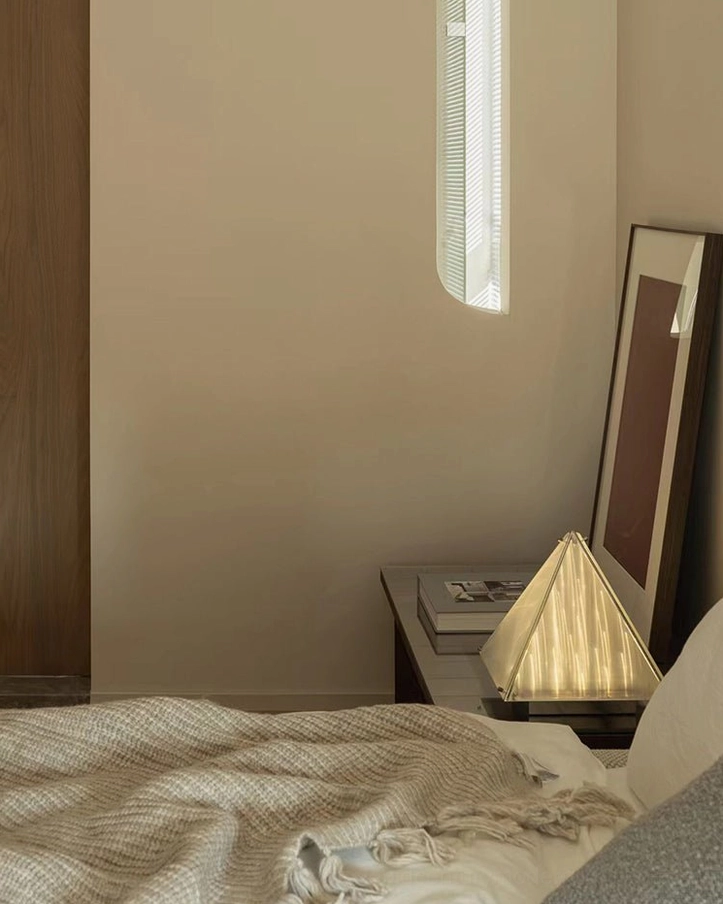 Fragment pyramid lamp showing warm LED integrated light source and clear shade material