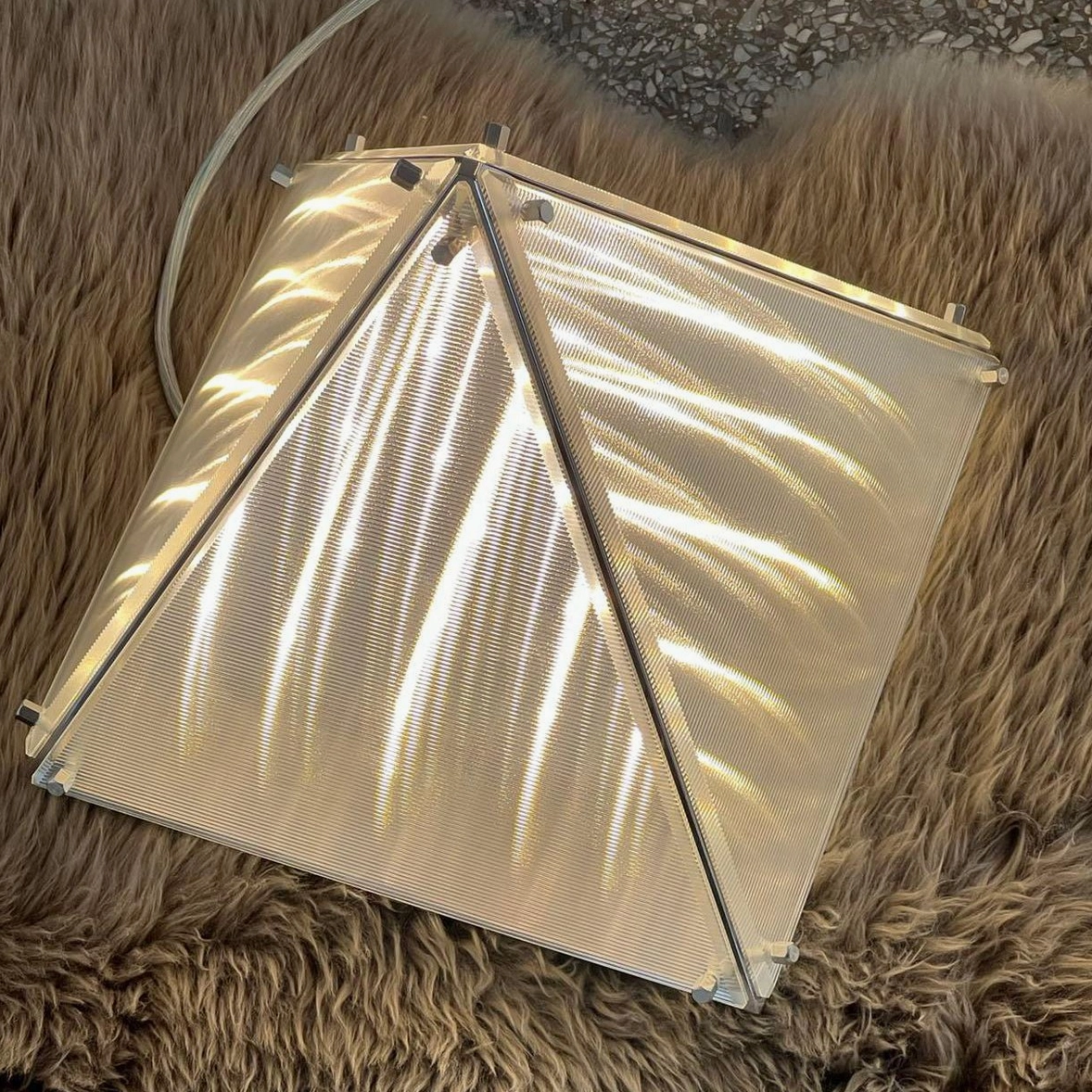 Modern pyramid table lamp full product shot showing overall design and chrome finish quality