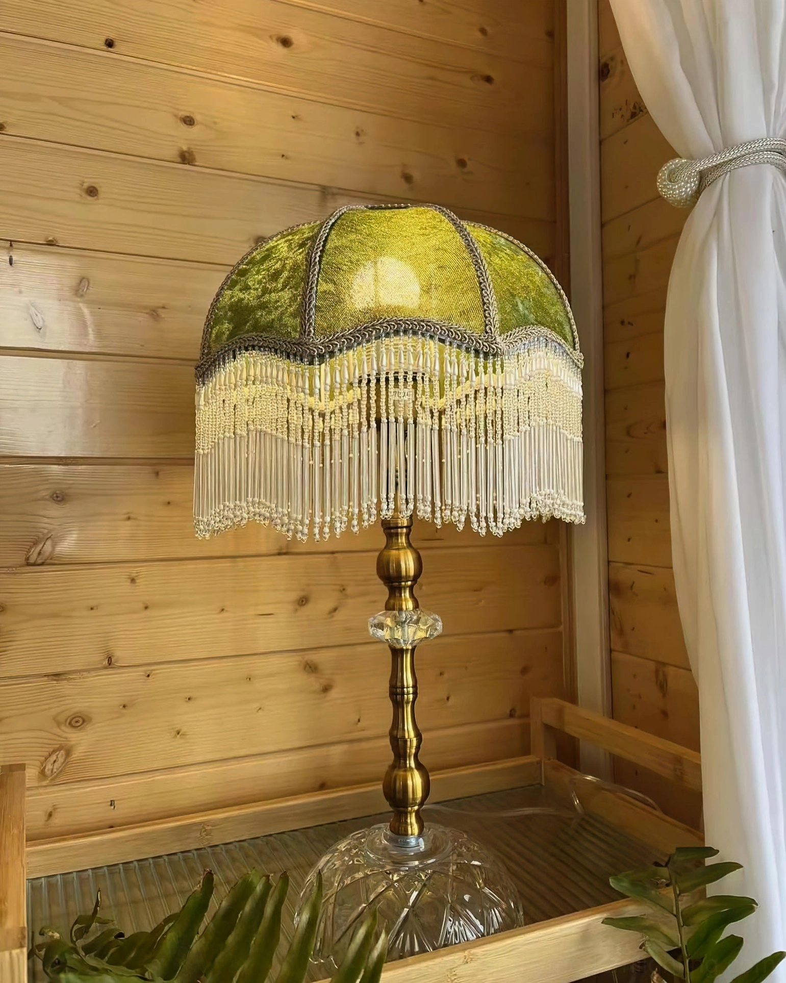 Beaded tassel fringe table lamp three-quarter view showing fabric shade and metal base