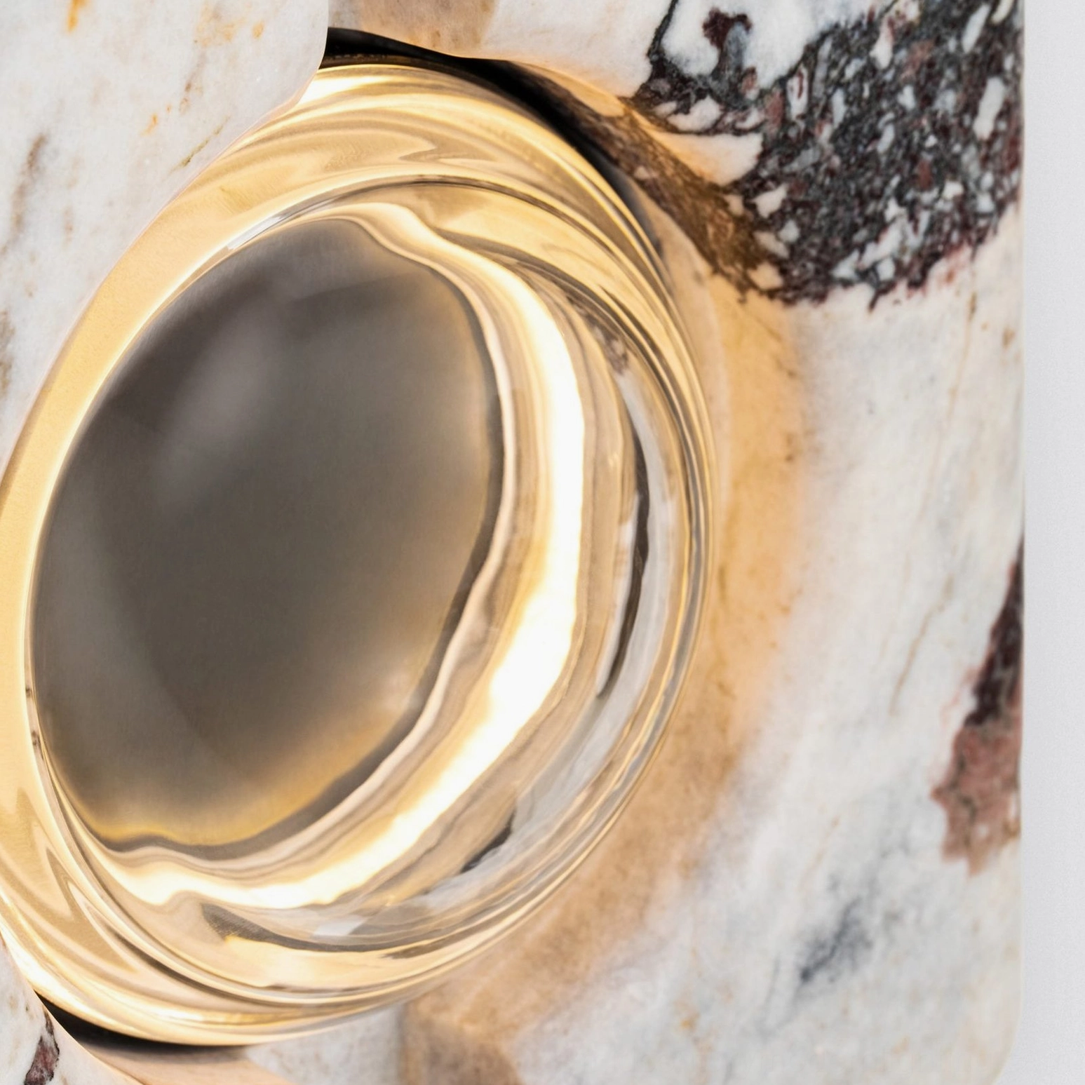 Overhead close-up view of lamp socket showing frosted glass and gold metal trim
