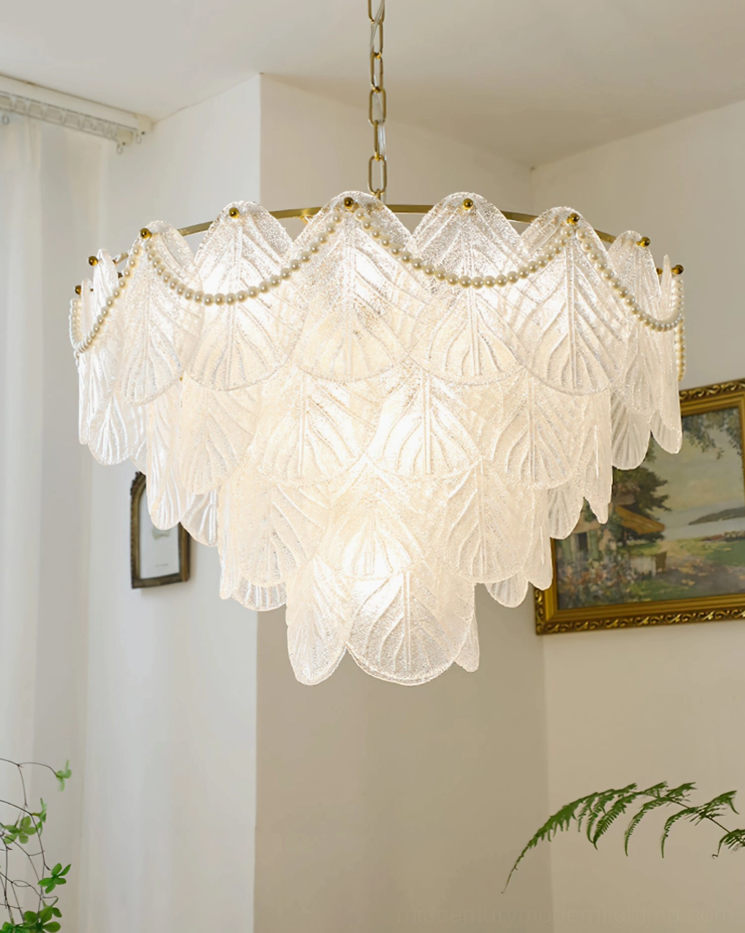 Detailed view of frosted glass leaf layers and brass hardware on tiered mid-century pendant chandelier, showcasing artisanal craftsmanship and elegant construction