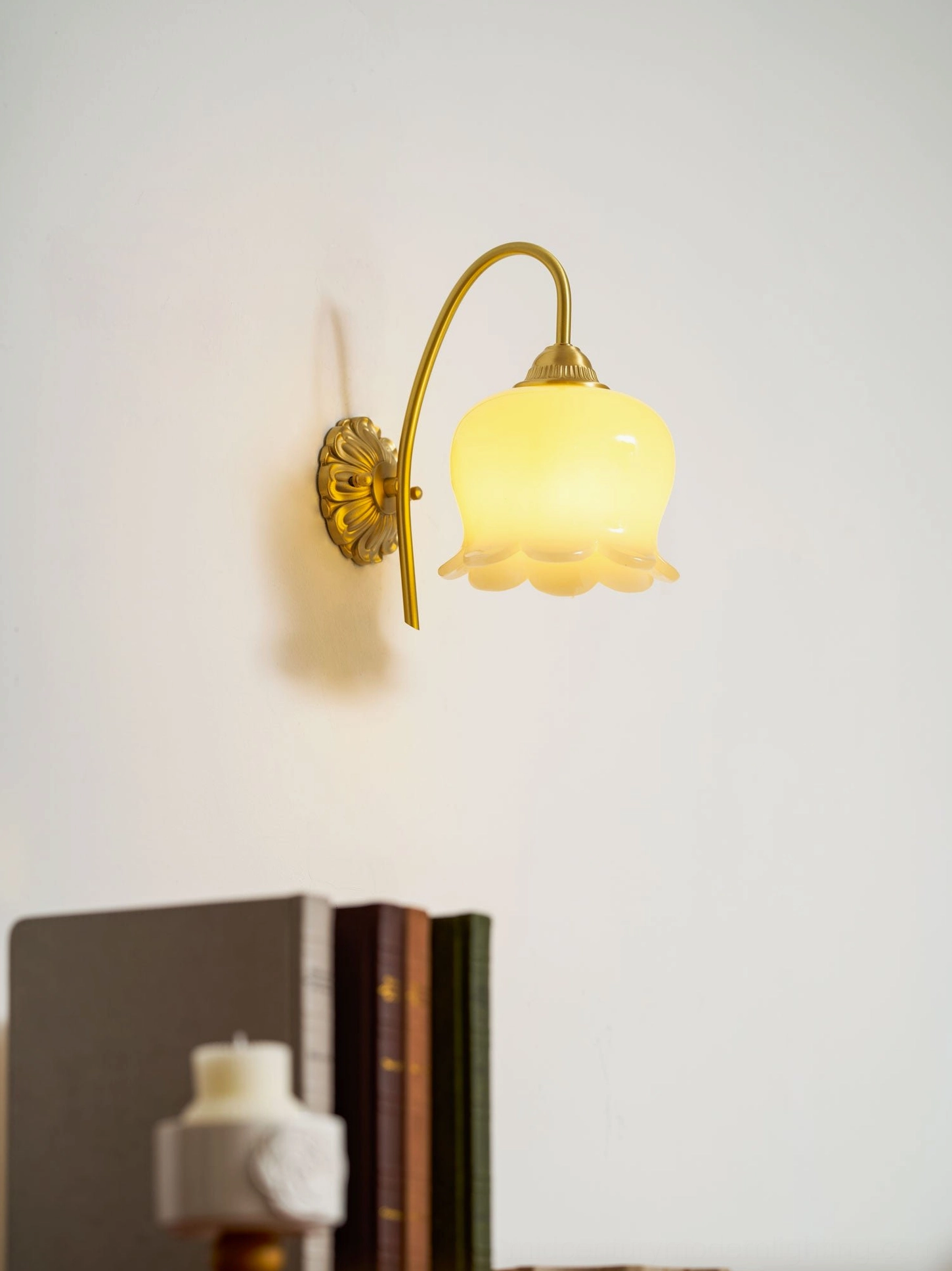 Close-up of lily of the valley wall lamp frosted glass shade with intricate petal detailing