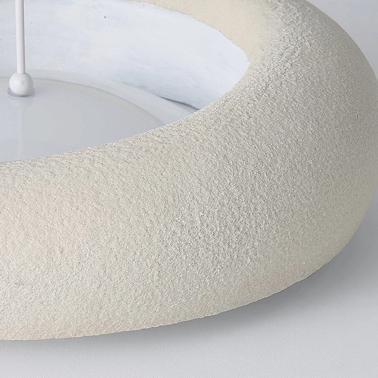 Side profile close-up of frosted resin circular shade with textured matte finish and warm light