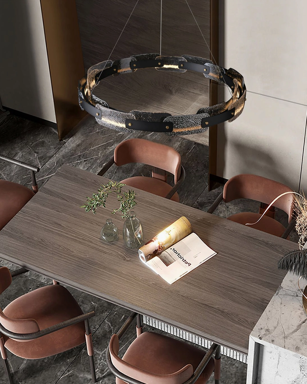 Fuze circular modern pendant light above dining table with brown furniture and wooden surfaces, low-angle side view
