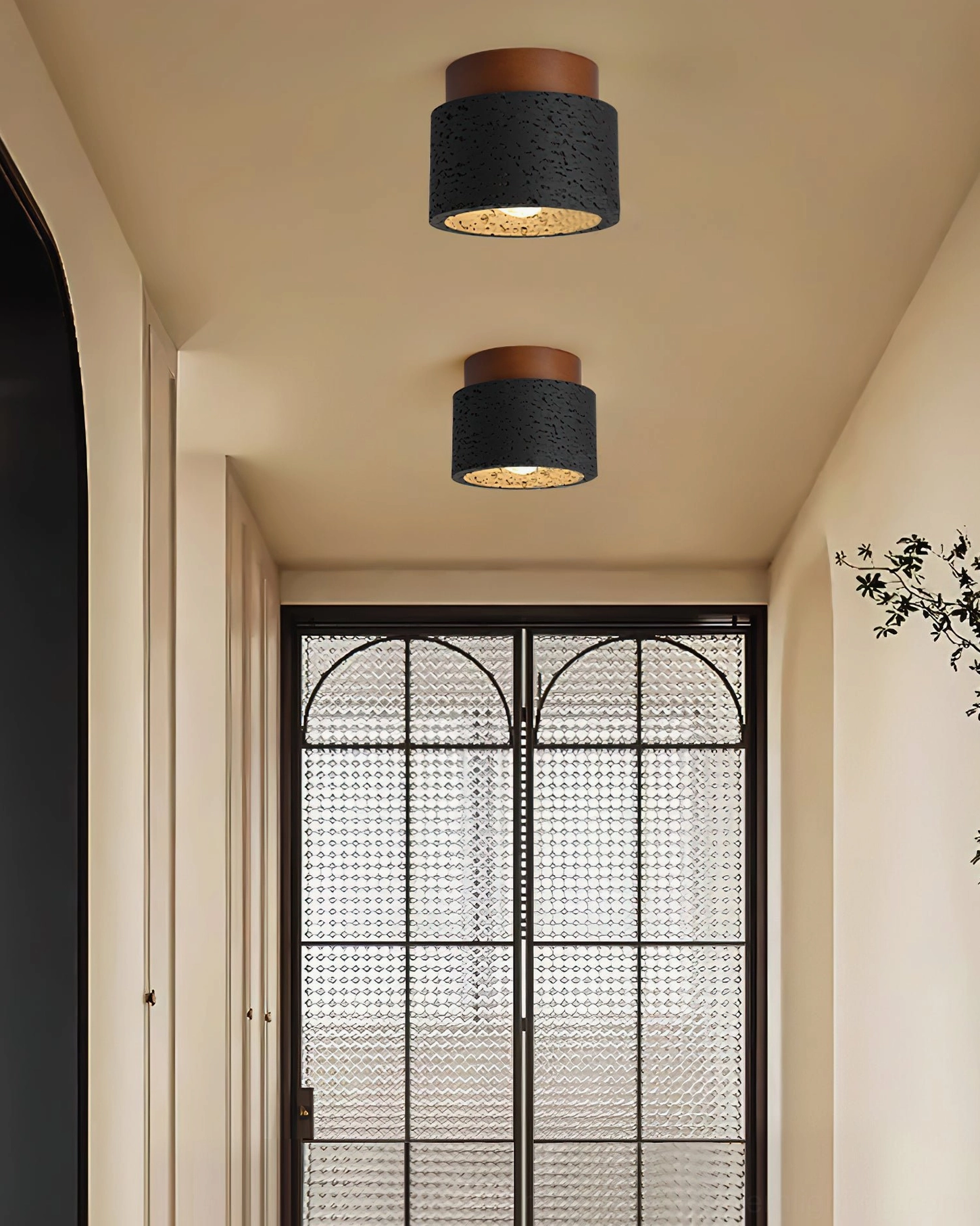 Gaila black cylindrical travertine ceiling light residential entryway grid glass door detail