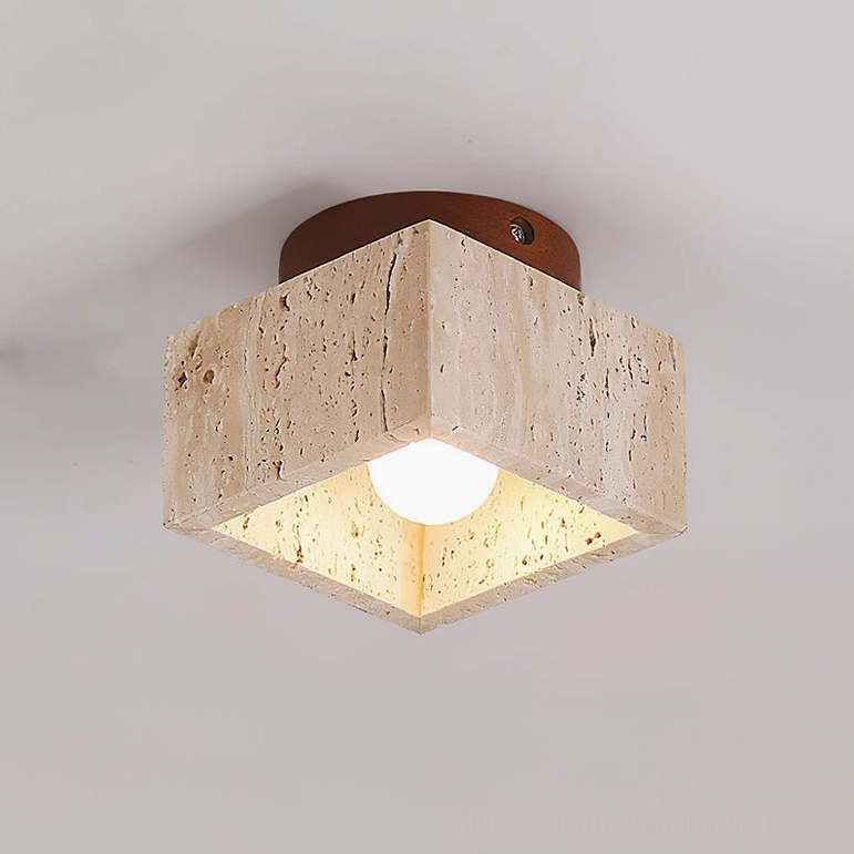 Gaila travertine flush mount ceiling light close-up showing natural stone pores and E27 bulb detail