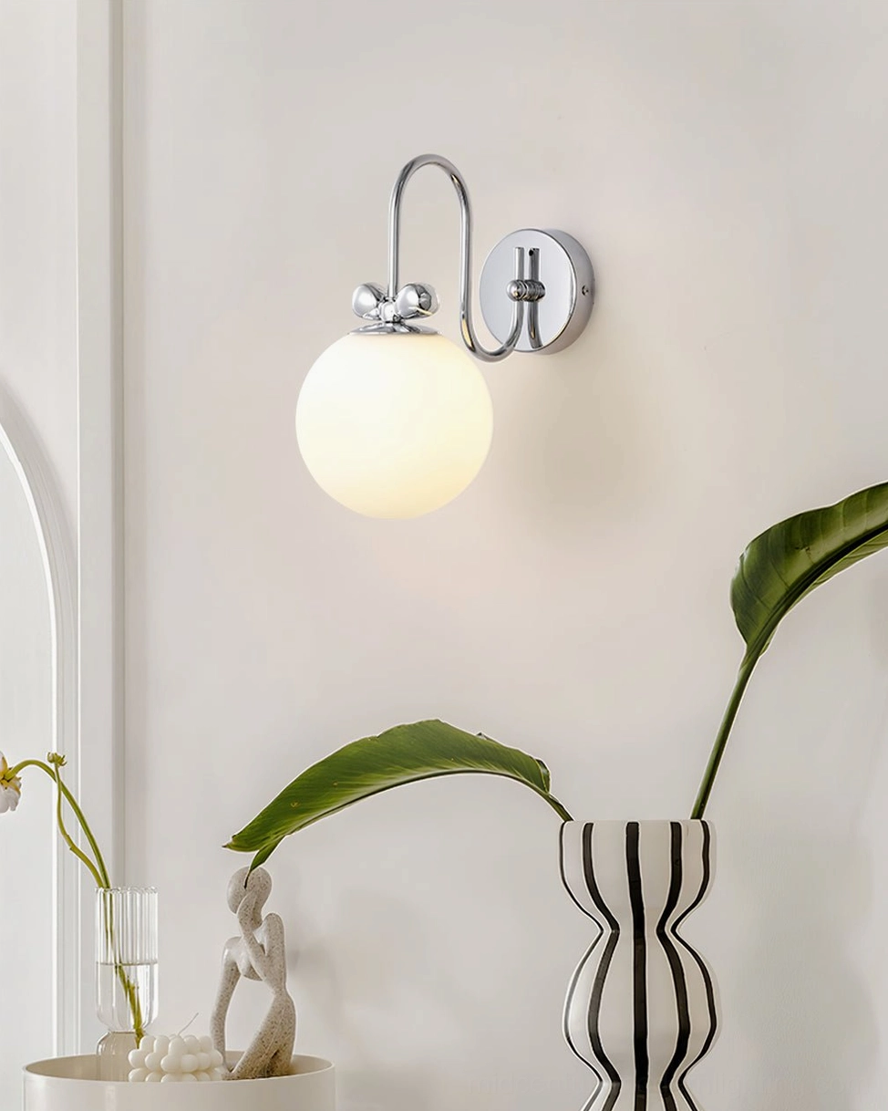 Galaxy Lux modern wall sconce installed above vanity with minimalist Scandinavian aesthetic and soft directional lighting