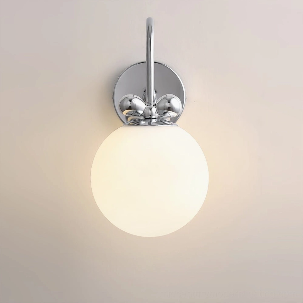 Galaxy Lux wall sconce in bedroom setting providing ambient illumination with warm frosted glass glow in modern residential interior