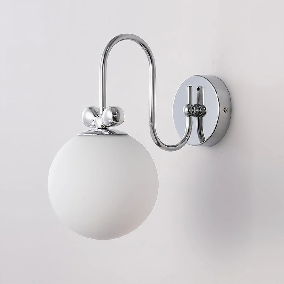 Galaxy Lux compact wall sconce with small frosted glass globe and polished chrome wall mount base in minimalist installation