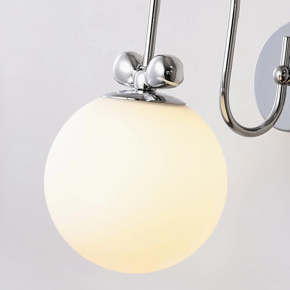 Low-angle macro close-up of Galaxy Lux oversized frosted glass shade and chrome decorative joints showing craftsmanship detail