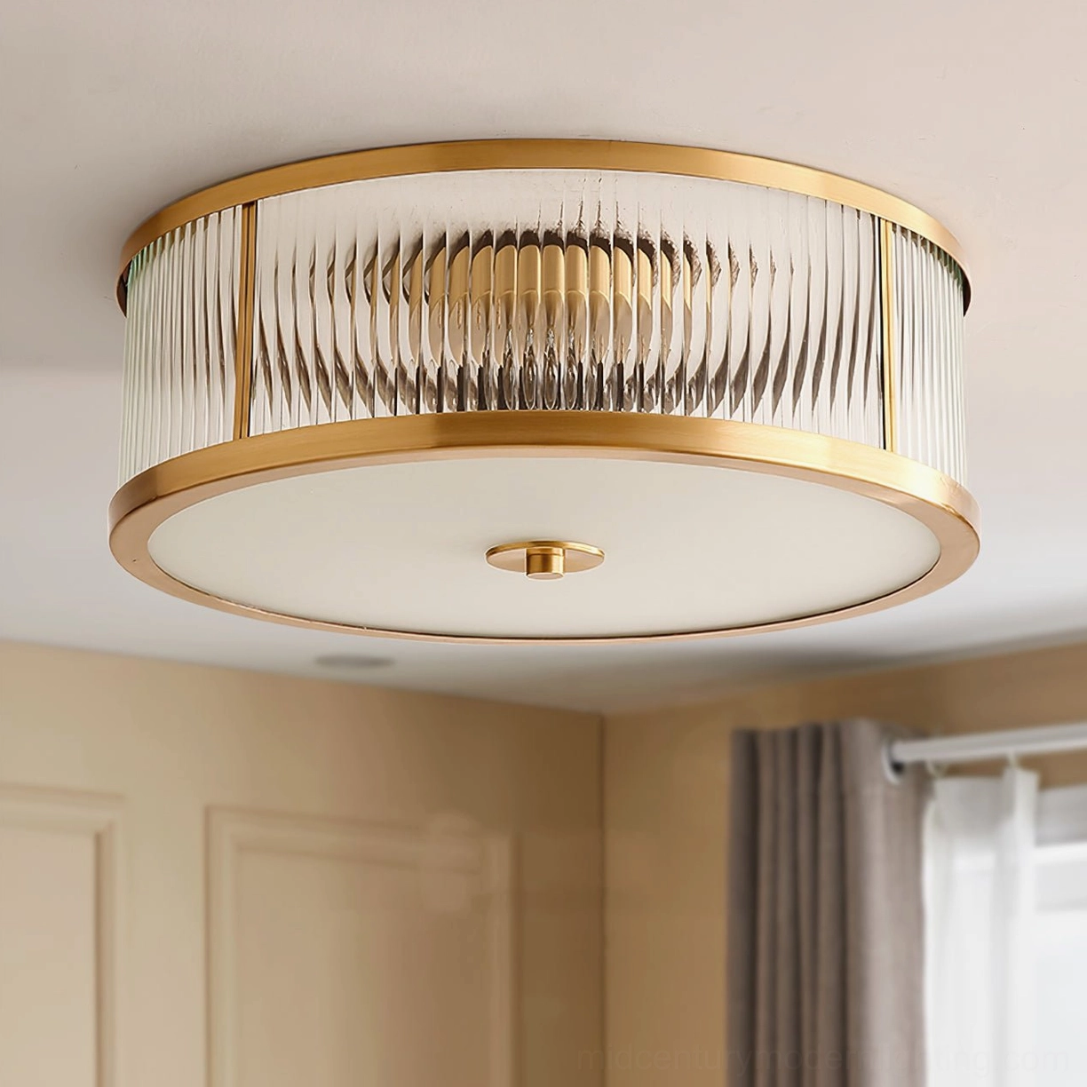 Geneva flush mount ceiling lamp detail showing brass metal frame and clear glass shade texture