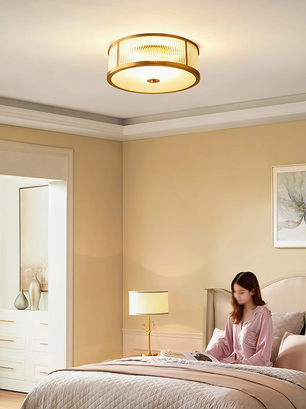 Geneva modern ceiling lamp illuminating cozy bedroom with pink loungewear and warm yellow walls