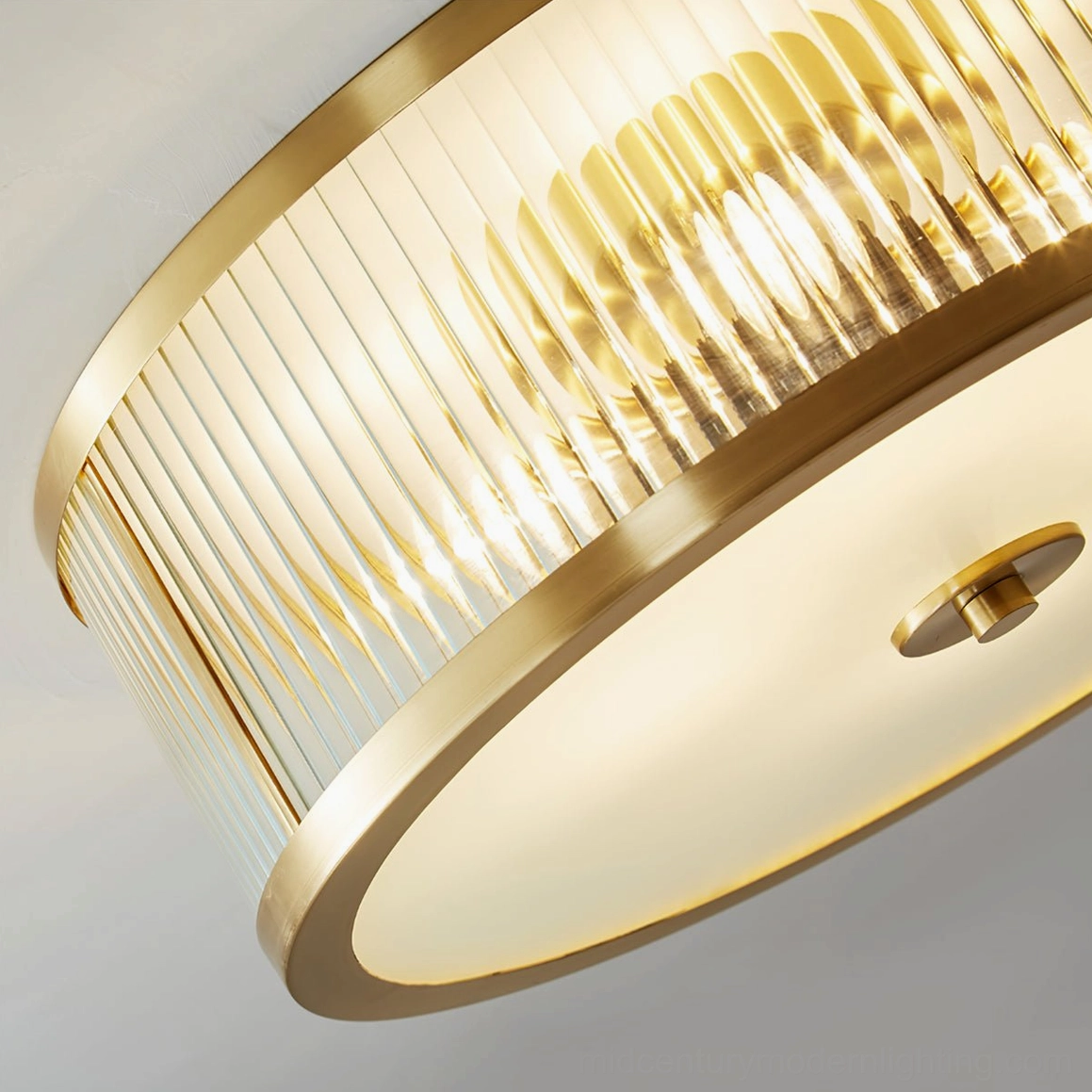 Geneva ceiling lamp in contemporary bathroom with modern fixtures and polished brass accents