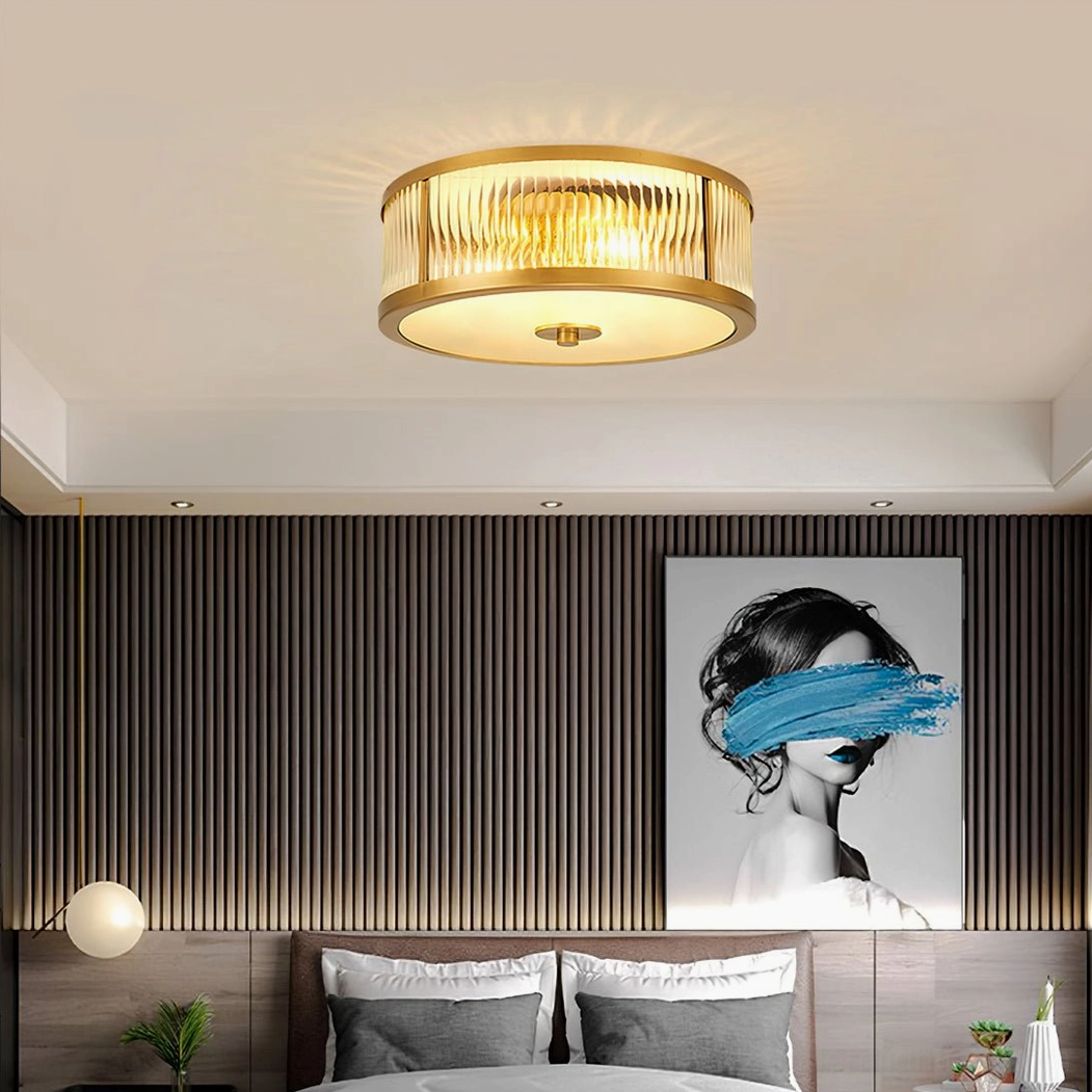 Geneva brass ceiling lamp close-up detail view showing ribbed clear glass and polished brass fixture