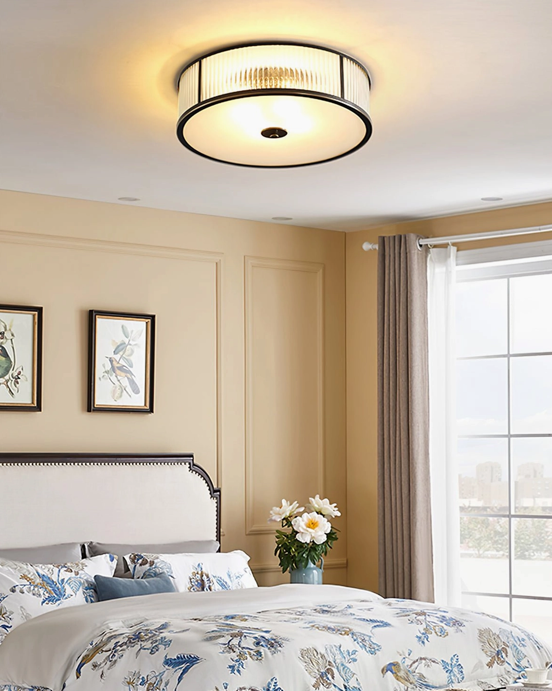 Geneva brass ceiling fixture shown in contemporary dining room with mid-century furniture styling