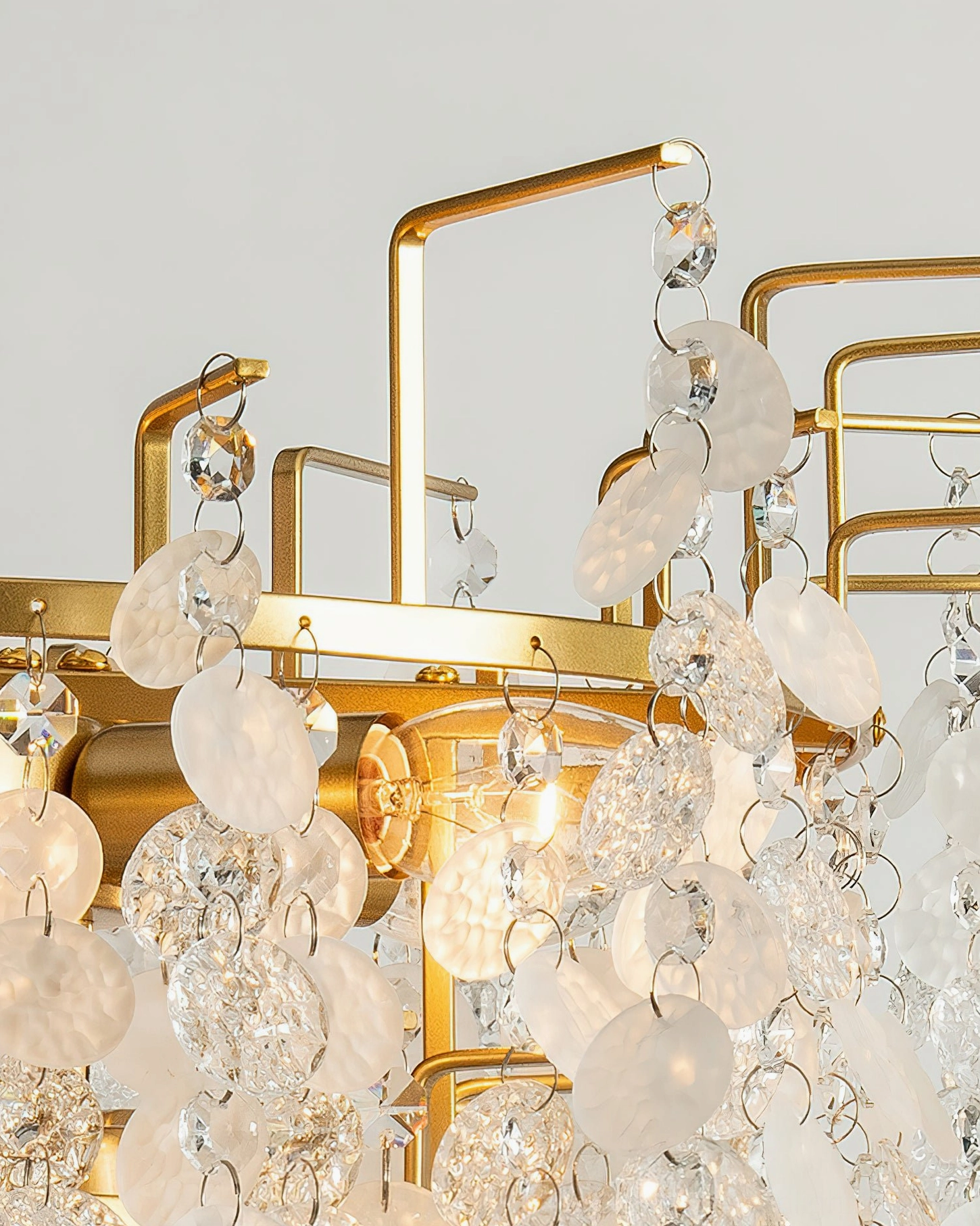 Macro close-up of Gevan chandelier mixed clear and frosted crystal beads and discs