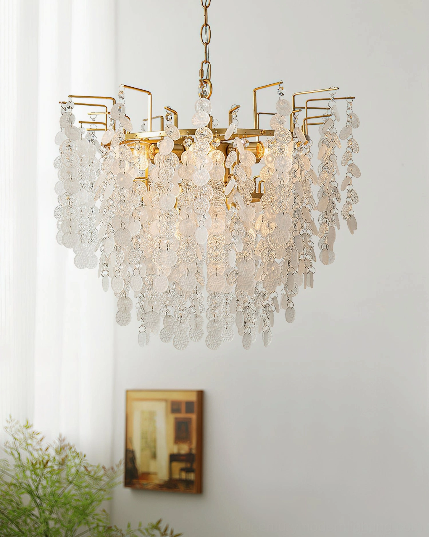 Gevan crystal chandelier illuminated in modern living room with french windows