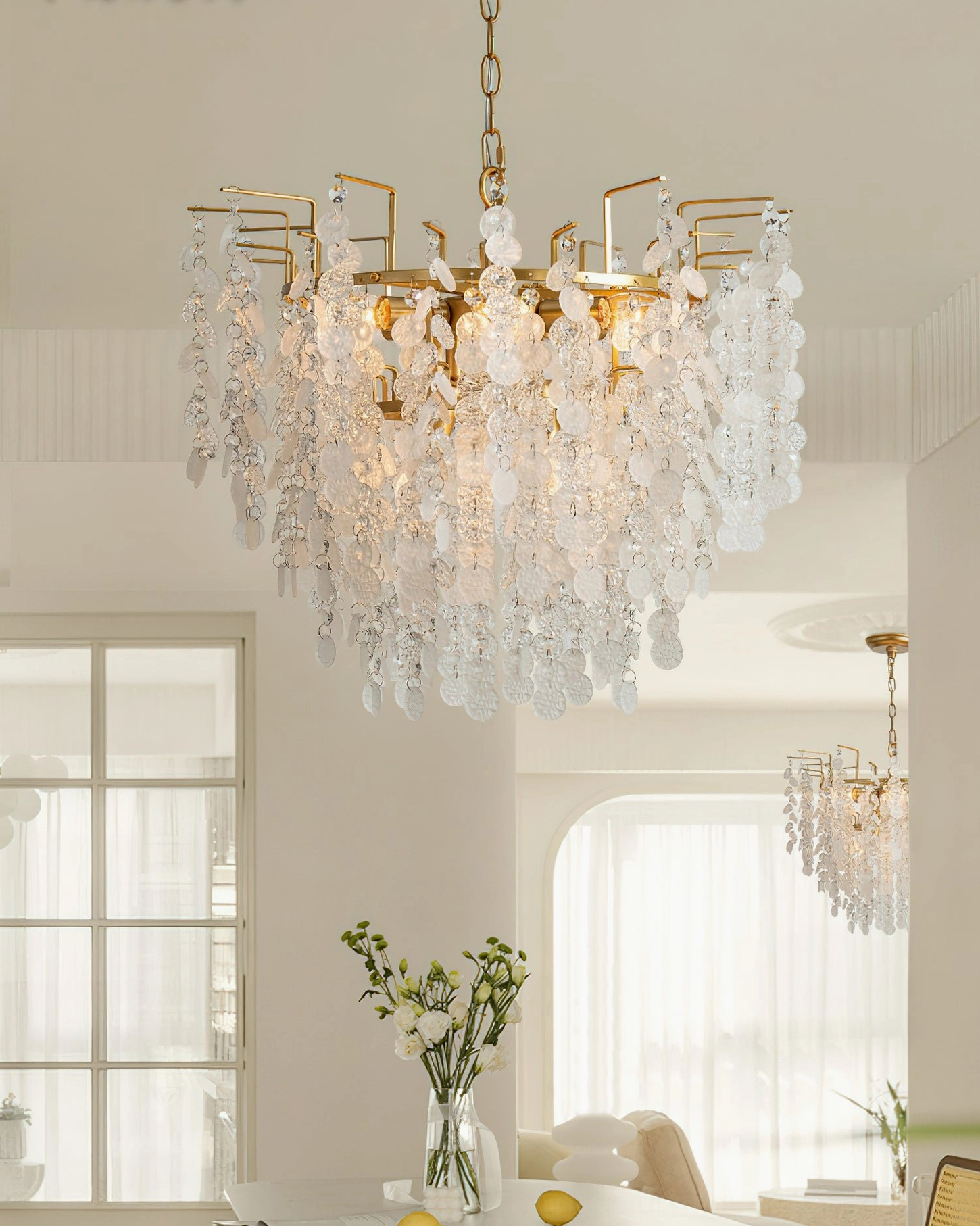 Gevan brass crystal chandelier wide frontal view in bright residential setting