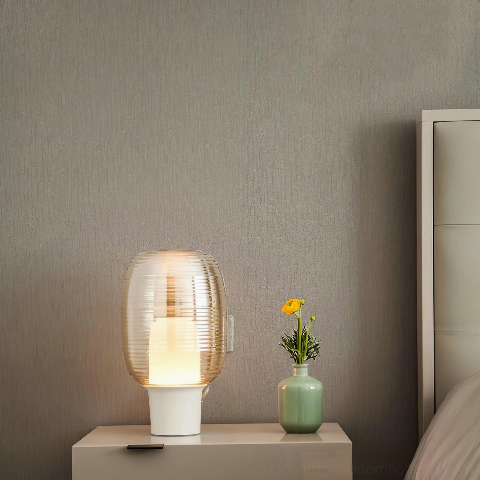 Ghia table lamp sculptural design showing organic pillow-like shape and ribbed glass details