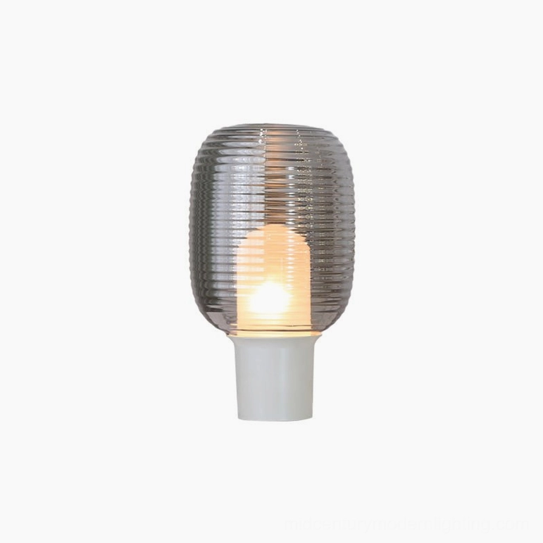 Ghia smoke grey ribbed glass table lamp with white aluminum alloy base in neutral studio lighting